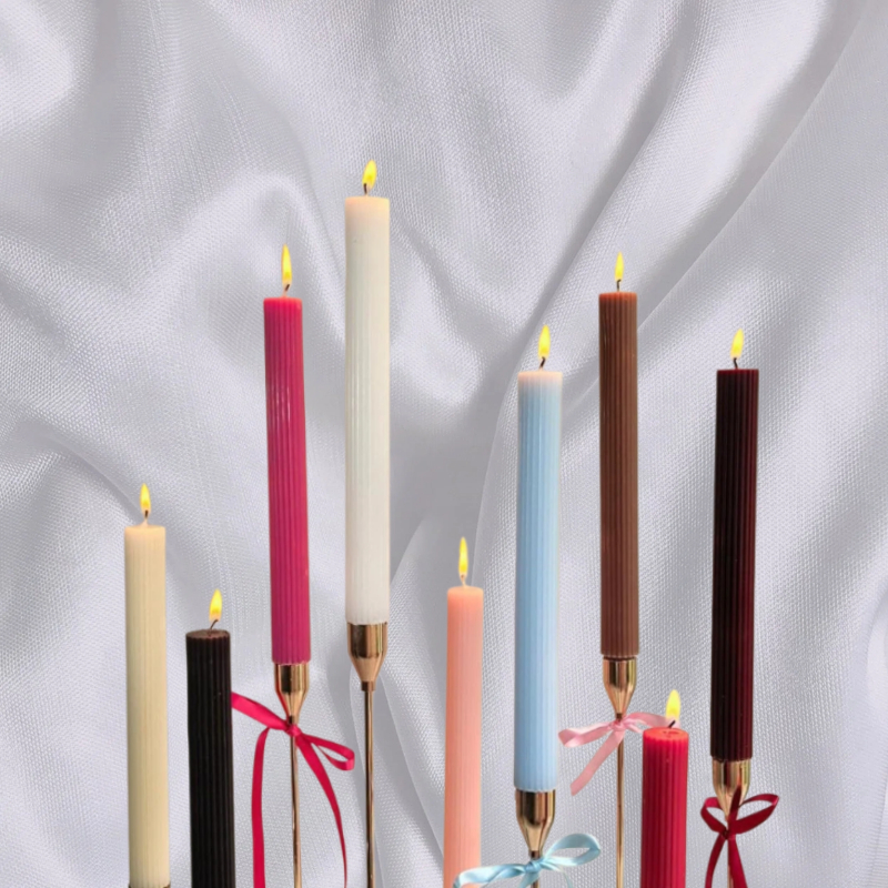 Slim Roman-style candles in summer colour schemes