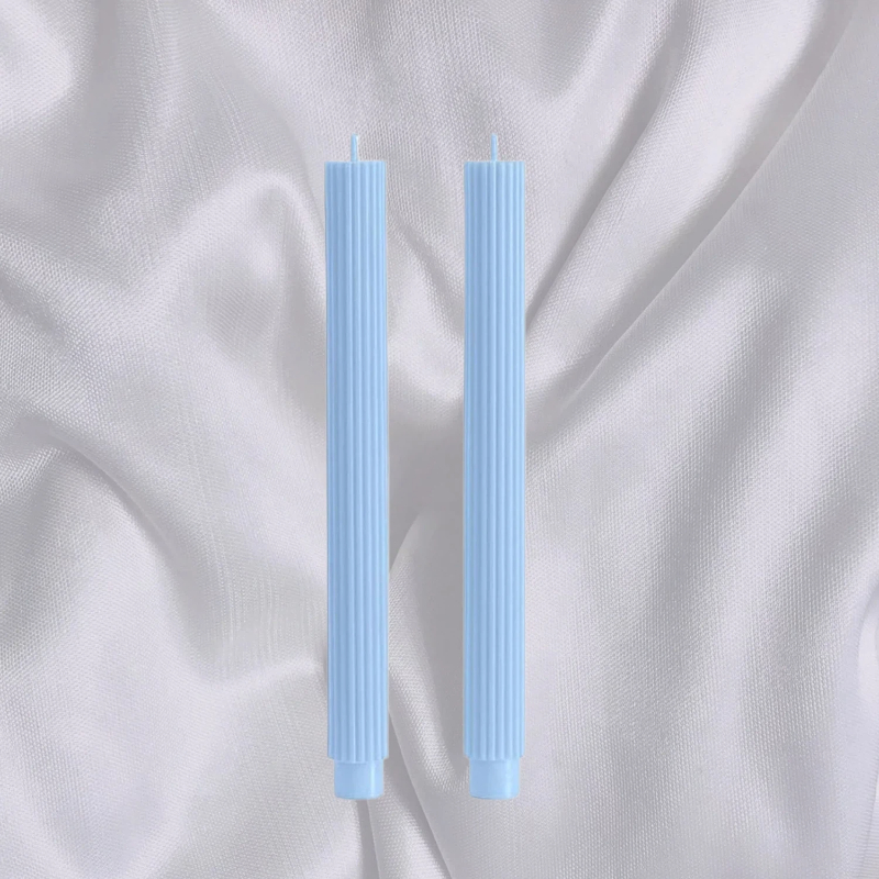Slim Roman-style candles in summer colour schemes