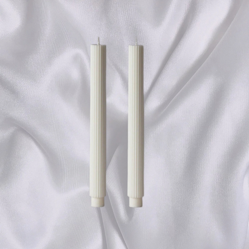 Slim Roman-style candles in summer colour schemes
